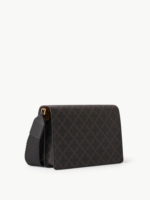 By Malene Birger Loenna crossover-veske i brun polyvinyl chloride, med Signature Flower-mønster, skinndetaljer og justerbar skulderrem.