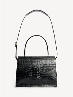 By Malene Birger Ronlas veske i sort kalveskinn med kroko-struktur.